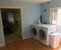 LAUNDRY/WET AREA WITH FULL SIZE WASHER AND DRYER